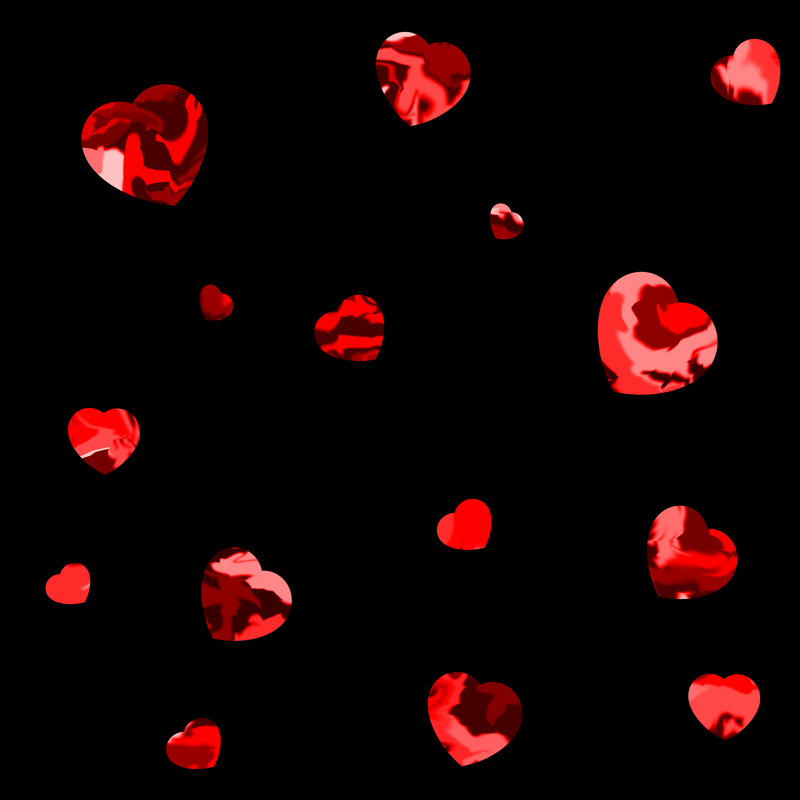 A scattering of dappled red hearts on a black background.