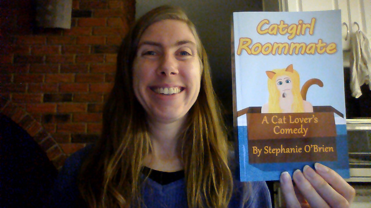 Stephanie holding Catgirl Roommate in paperback